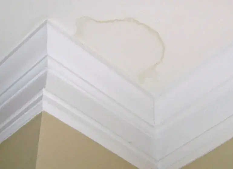 This ceiling has water damage from a leaking roof.